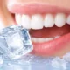 ice cube near teeth showing potential dental health risks